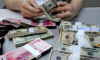 中国人民銀行の為替介入が中国企業に外貨取引で損失を与える